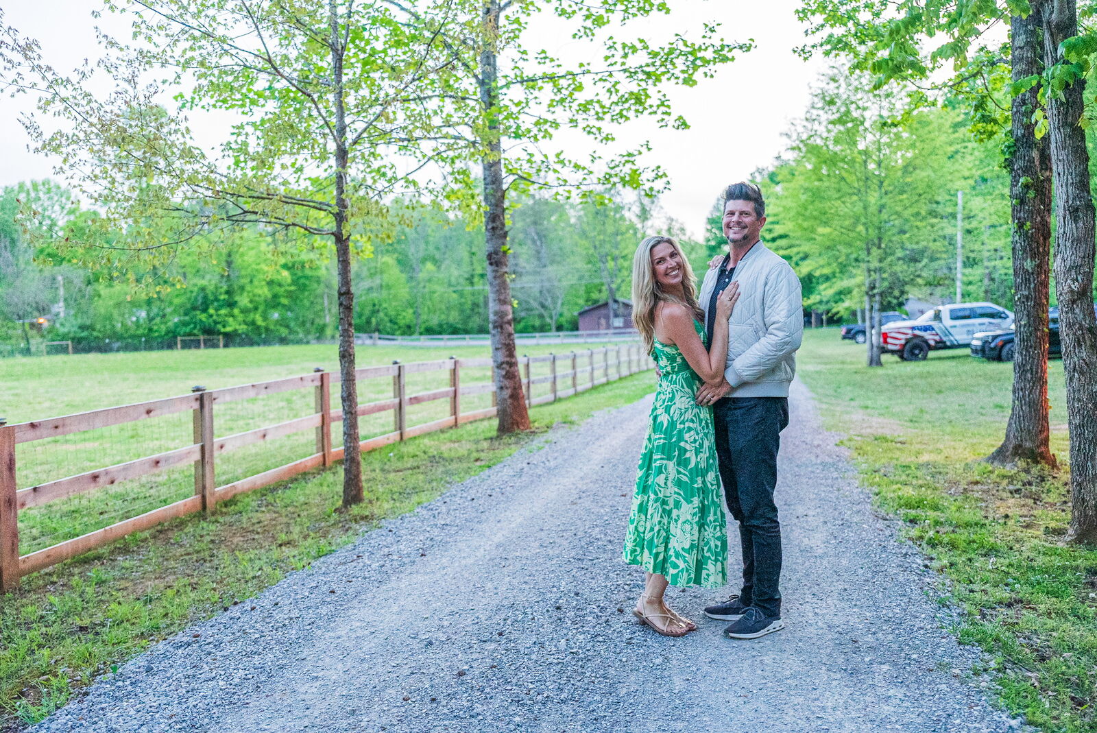 Couple on the tree-lined driveway