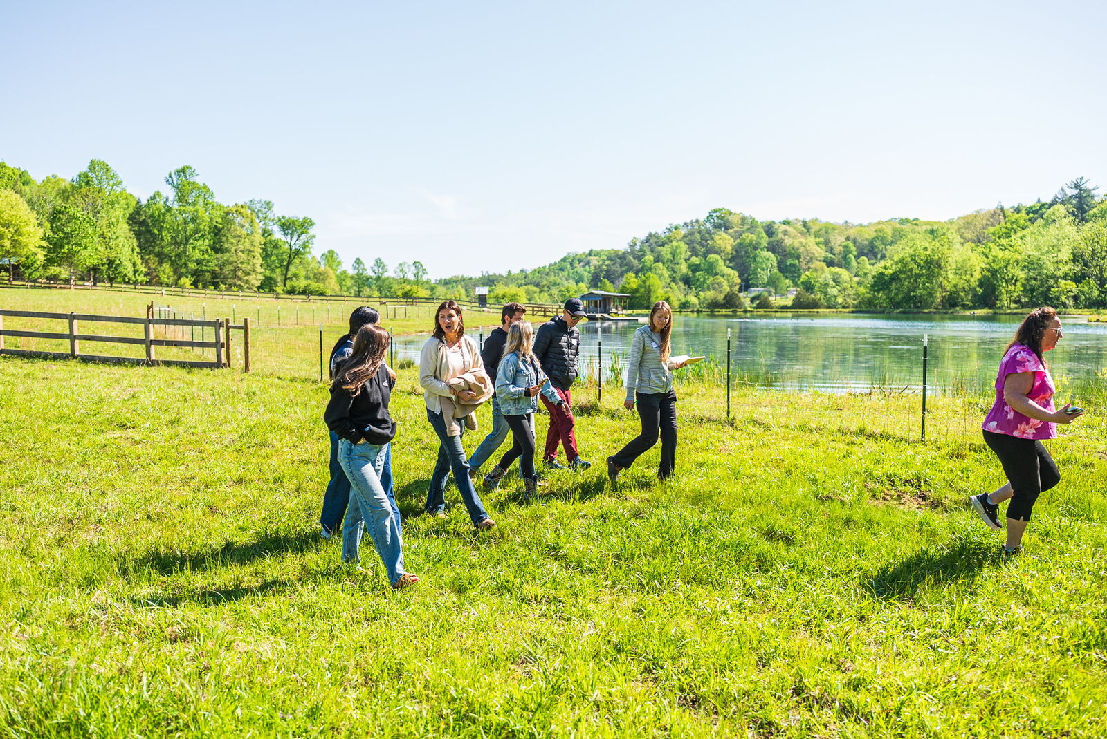 Group walking along the lake